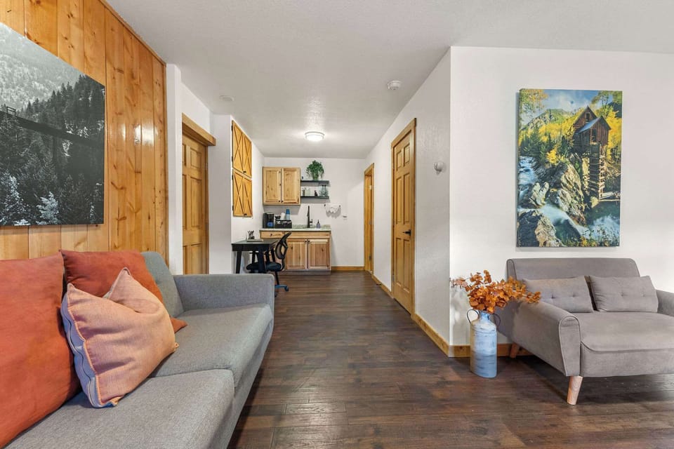 The Guest Lobby has a coffee maker, bathroom, desk and sofa. 