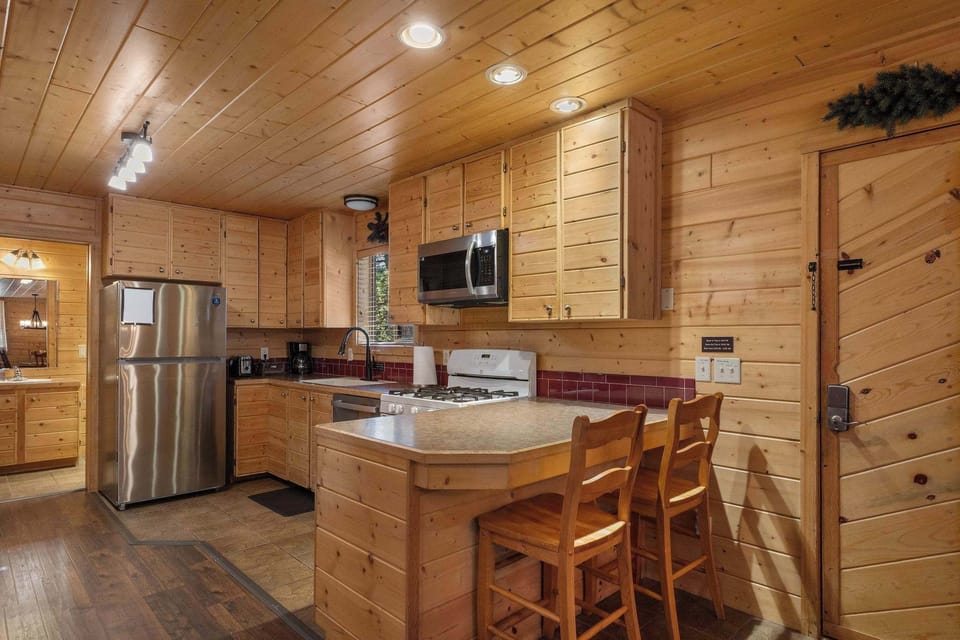 The full kitchen has plenty of counter space and 2 chairs at the countertop.