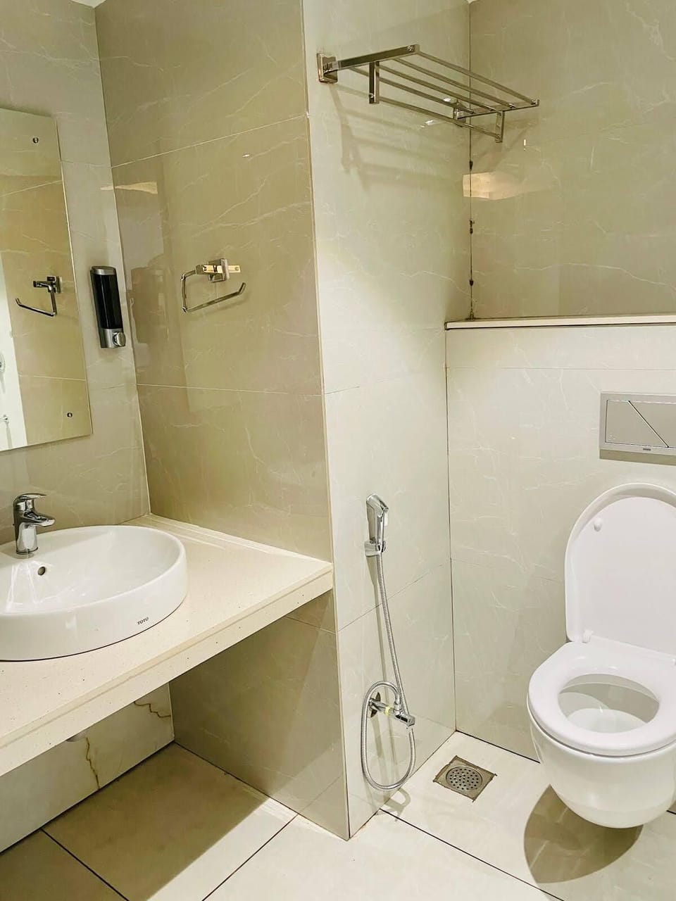Shower, rainfall showerhead, slippers, towels