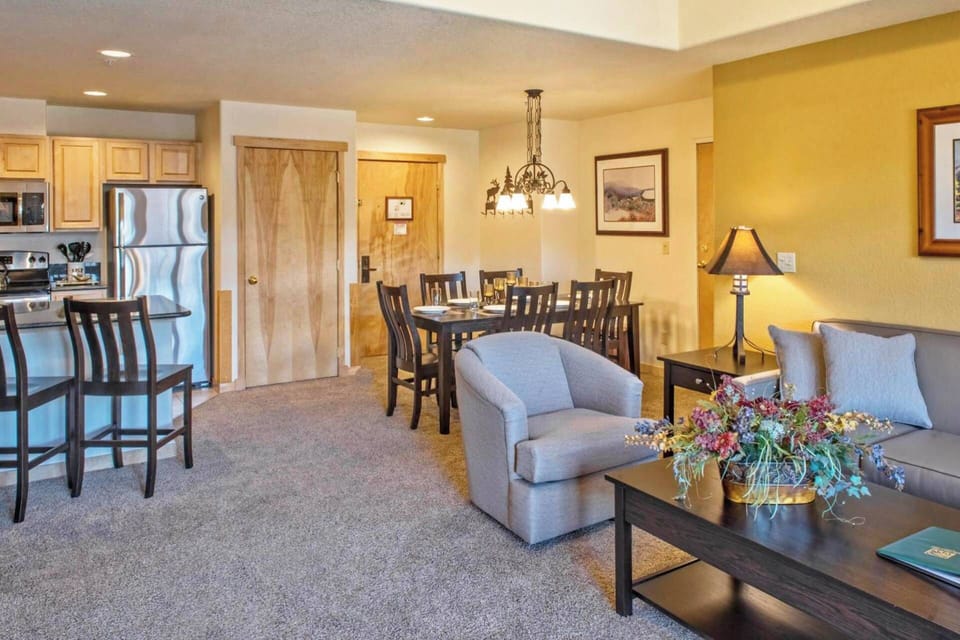 Living room features a sleeper sofa for two additional guests.