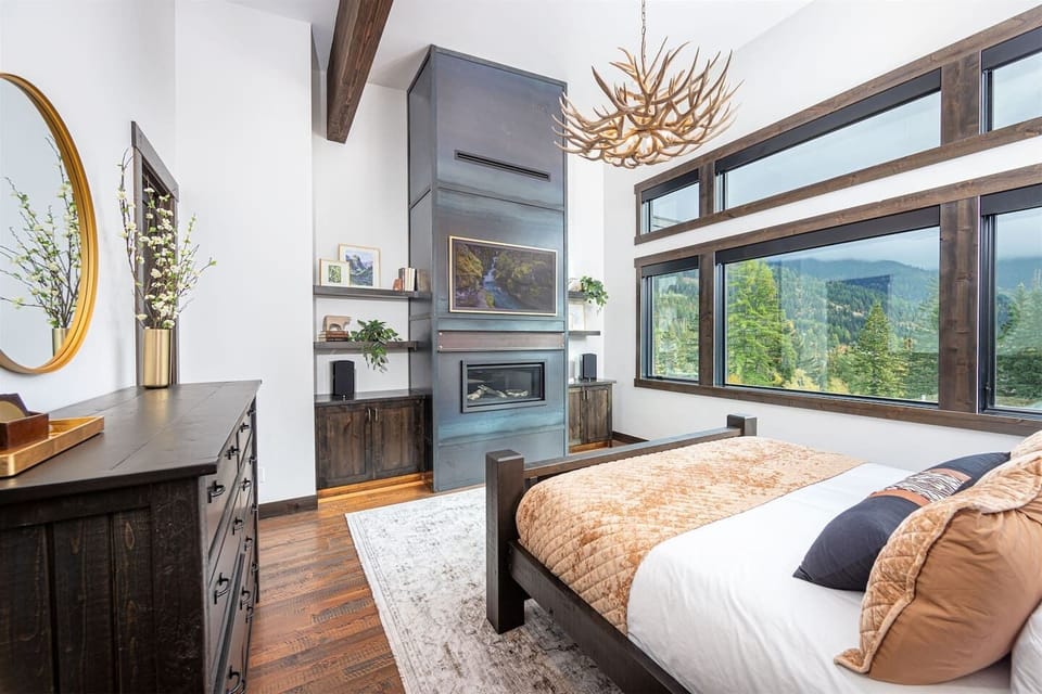 The master suite is a luxurious space to relax in - take in the mountain views as you enjoy your private fireplace.