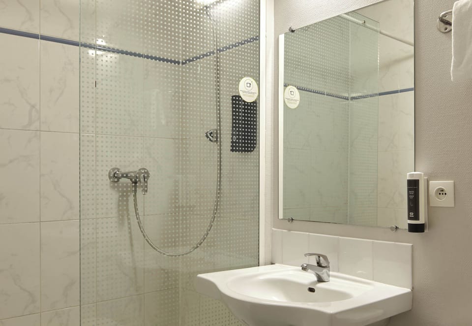 Shower, towels, soap, toilet paper