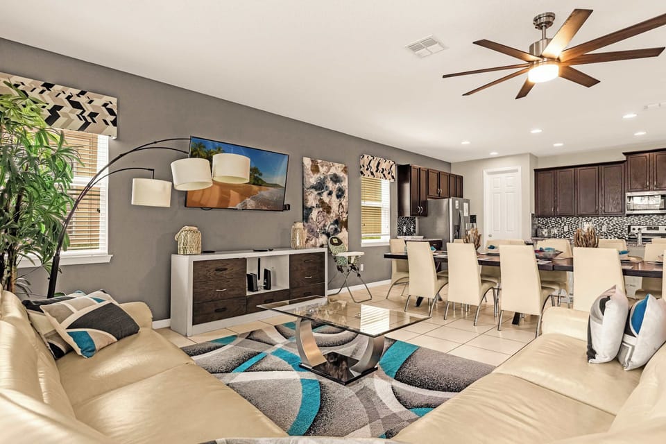 Spacious open-concept living and dining area perfect for entertaining, featuring modern decor and ample seating.