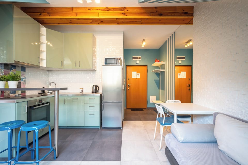 Apartment | Private kitchenette | Fridge, stovetop, electric kettle, cookware/dishes/utensils