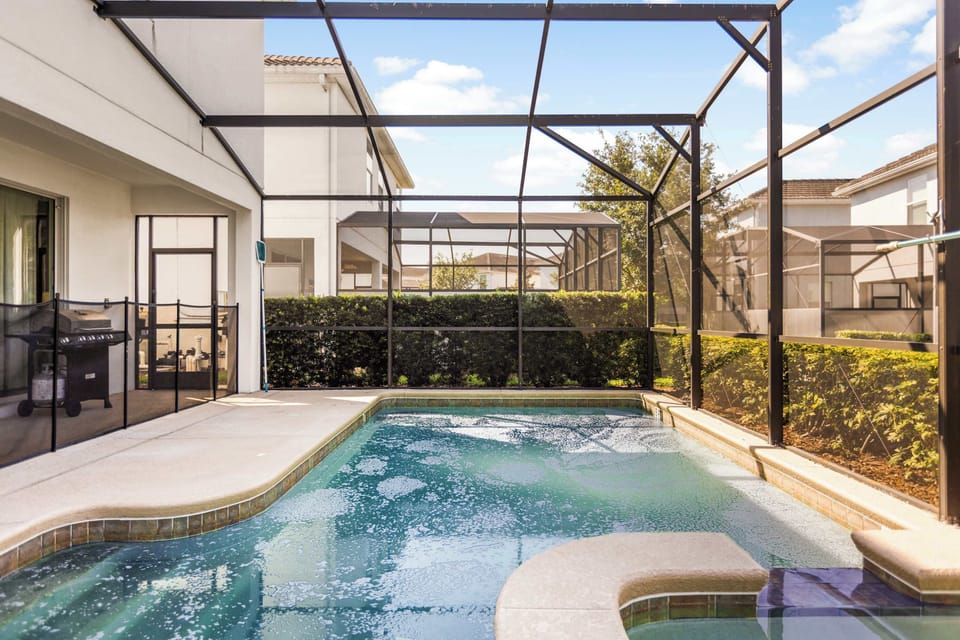 Relax in your private screened pool oasis, perfect for family fun and BBQs under the sun.