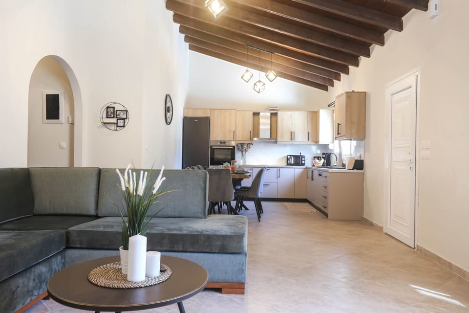 Open Living Room Area with Stylish Décor – Blending comfort and design in a large, light-filled space.