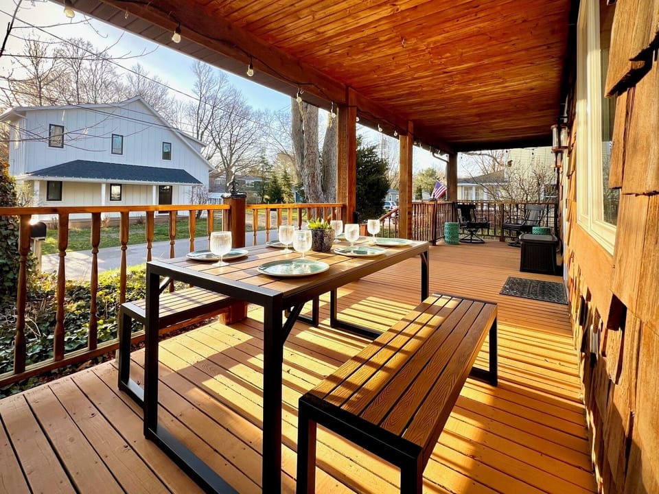 Enjoy fresh lake breeze and serenity of nature from expansive covered porch.