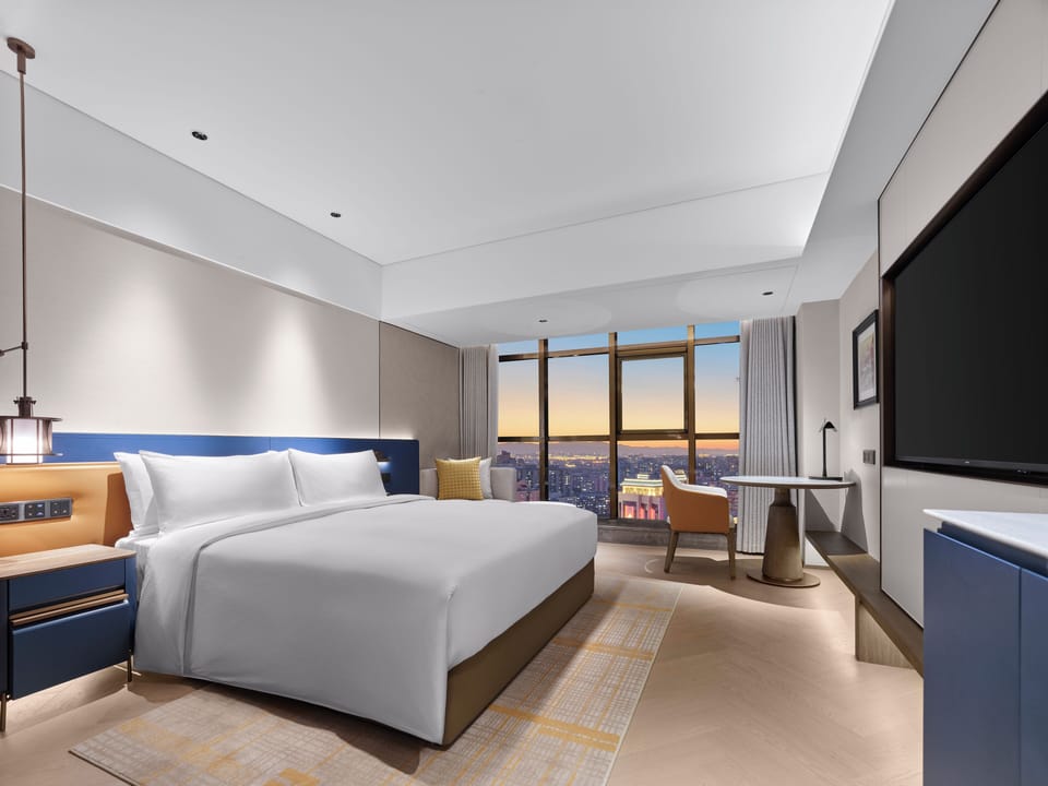 Deluxe Room, 1 King Bed | In-room safe, desk, laptop workspace, blackout drapes