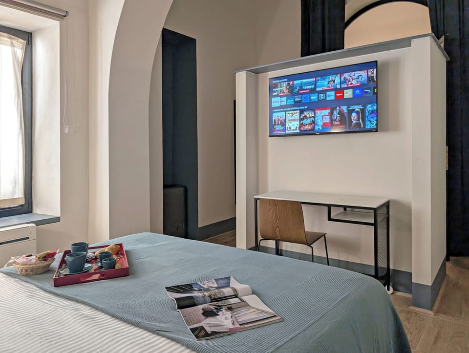 Premium bedding, memory foam beds, desk, laptop workspace