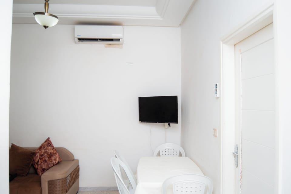Basic Apartment, Balcony | Living area | Flat-screen TV