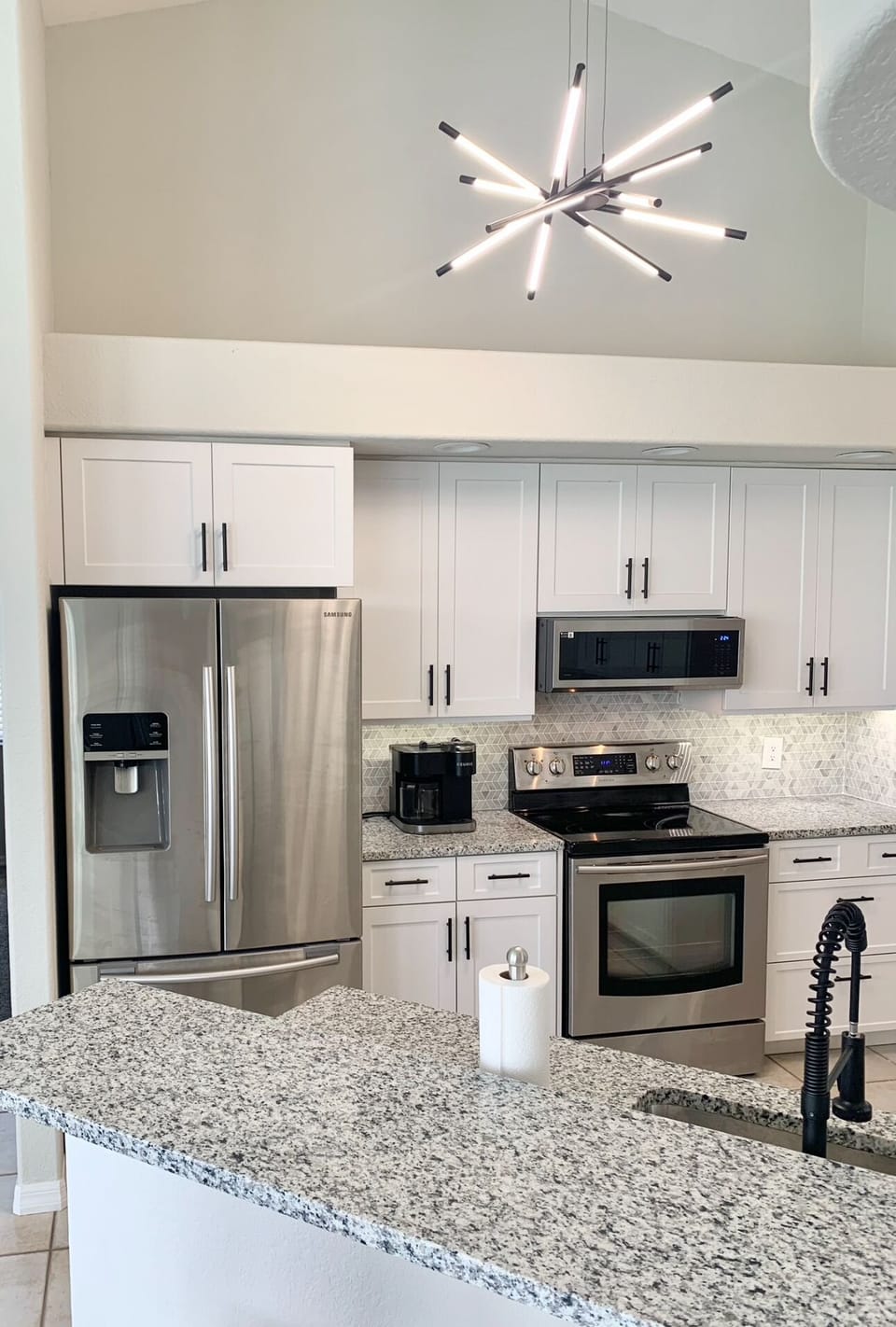 MODERN KITCHEN WITH ALL NEW STAINLESS STEEL APPLIANCES.