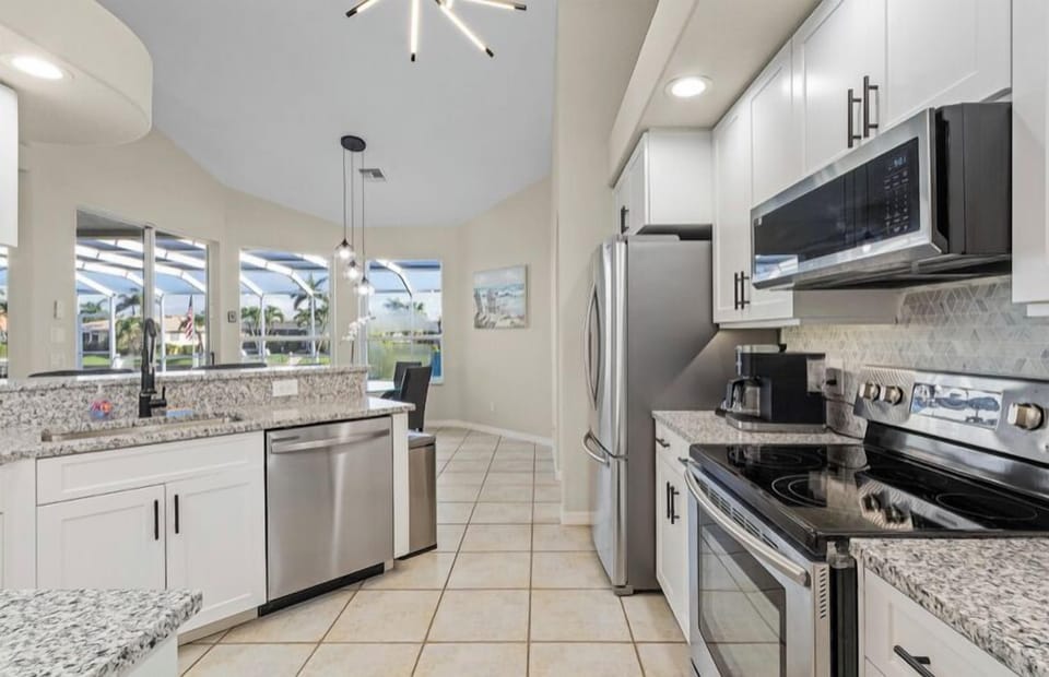 MODERN KITCHEN WITH NEW GRANITE AND STAINLESS APPLIANCES- KUERIG / DRIP COMBO