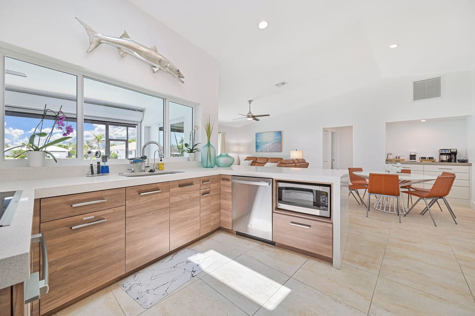 NEW DESIGNER KITCHEN WITH QUARTZ TOP AND CUSTOM CABINETS WITH WATERFRONT VIEWS