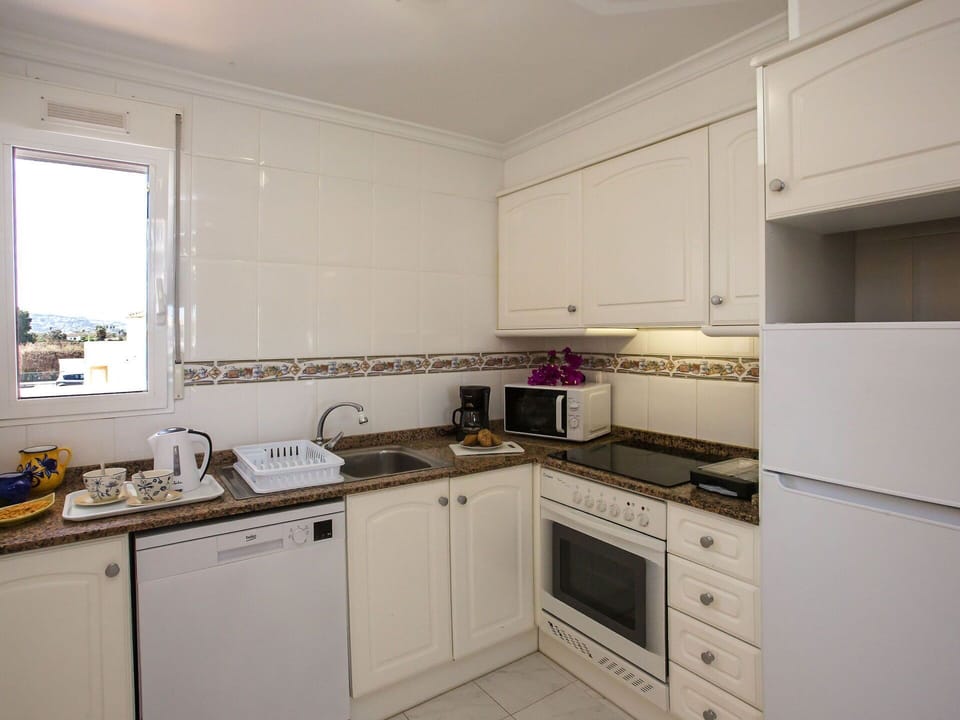 Cabinetry, Countertop, Property, Sink, Kitchen Sink, Kitchen Stove, Kitchen, Kitchen Appliance, Cooktop, Building