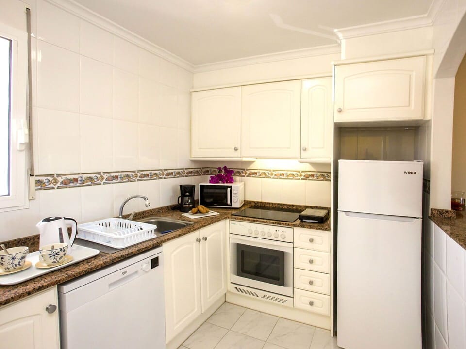 Cabinetry, Countertop, Sink, Kitchen Stove, Building, Kitchen, Kitchen Appliance, Wood, Cooktop, Interior Design