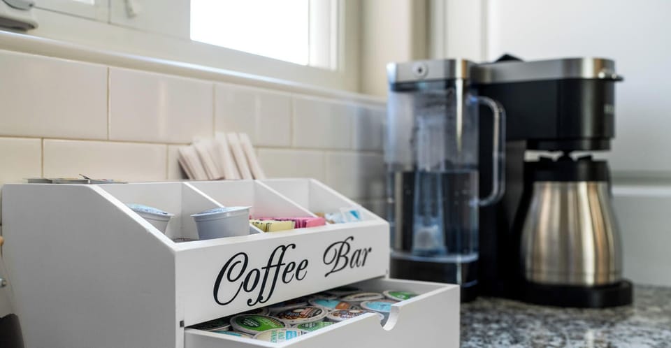"Start your day refreshed with a personalized brew from our chic Coffee Bar—a cozy touch to your stay at Irvie Homes, where comfort meets convenience. #VacationRental #HomeAmenities #MorningCoffee"