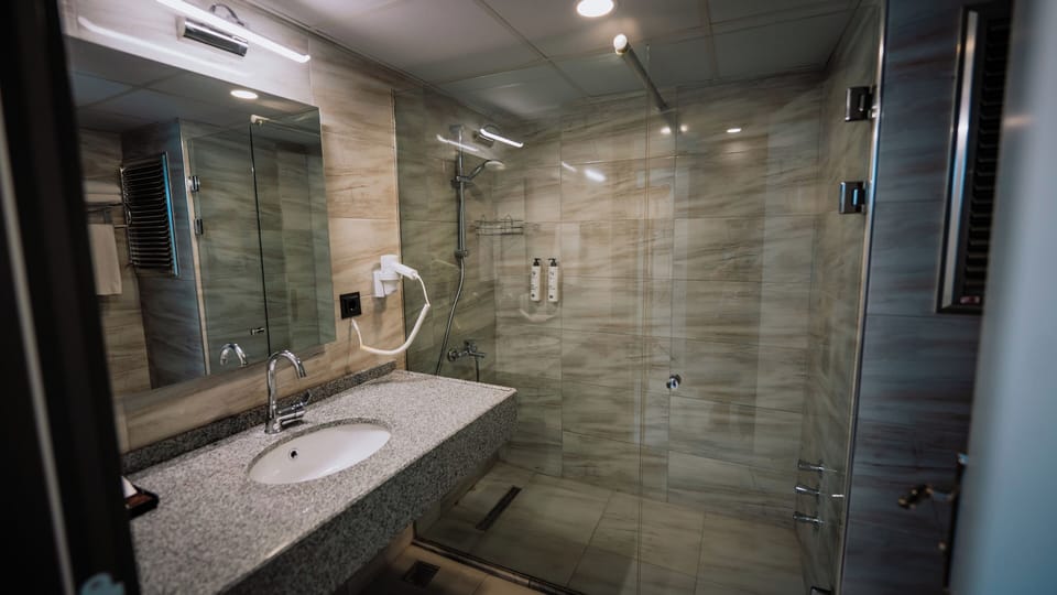Shower, free toiletries, hair dryer, slippers