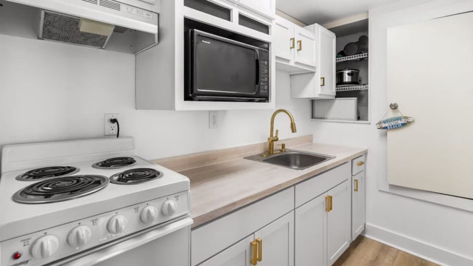 Your fully equipped kitchen features modern appliances and gleaming countertops, making meal prep a breeze during your stay.