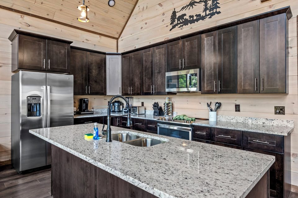 Sleek modern kitchen with granite countertops, stainless steel appliances, and ample storage space.