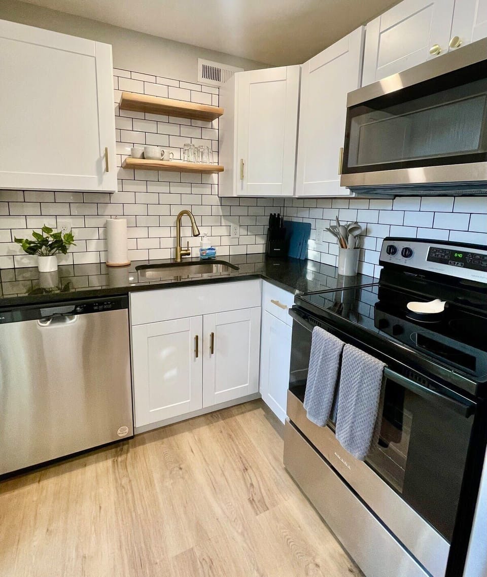 Brew coffee, cook dinner, live easy in this tidy kitchen.