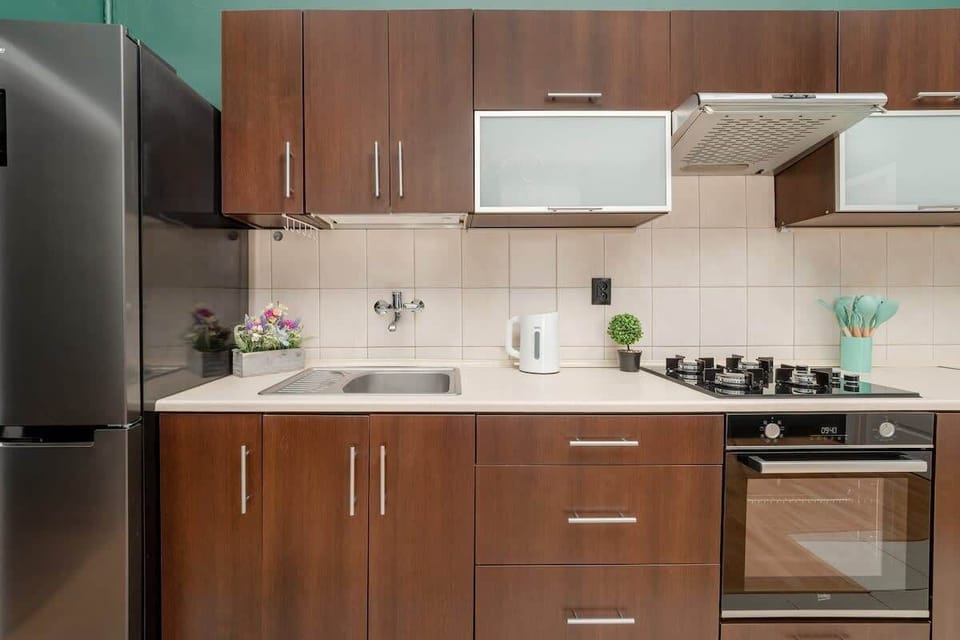 Bright kitchen with cooking utensils. 