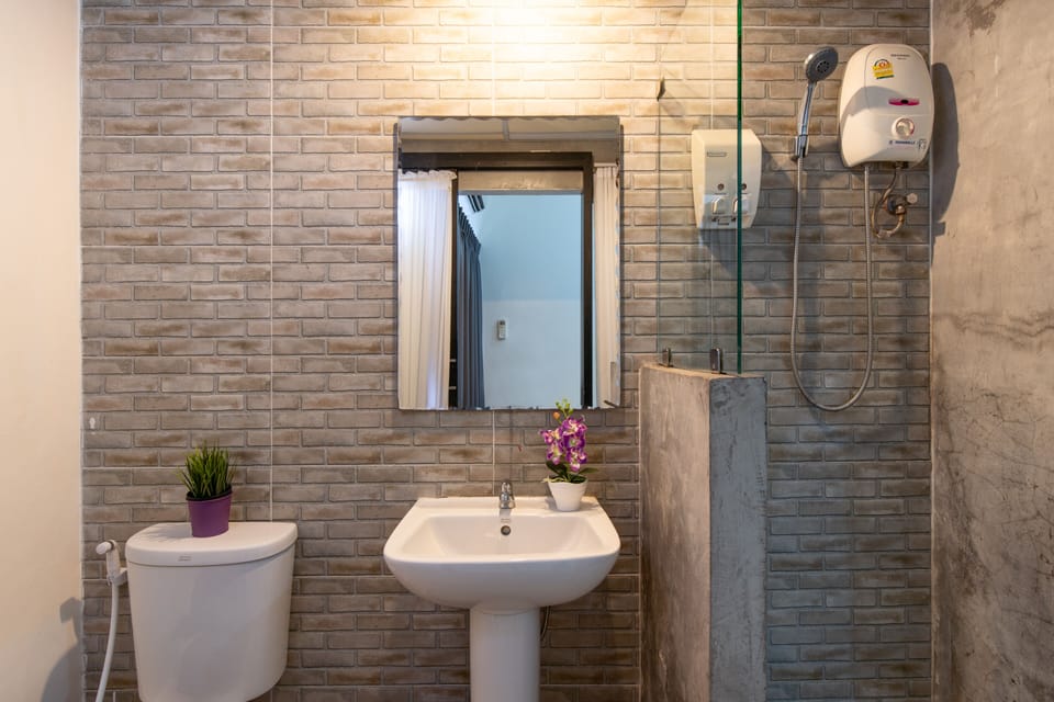 Relax | Bathroom | Shower, free toiletries, slippers, towels