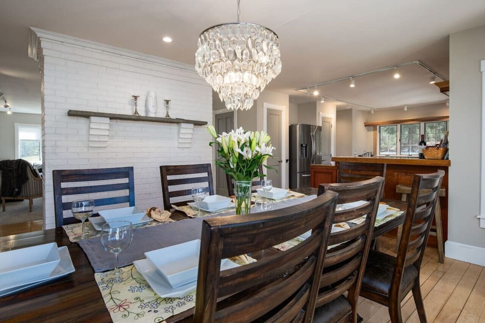 Enjoy meals by the dining table with expansive views through a large window.