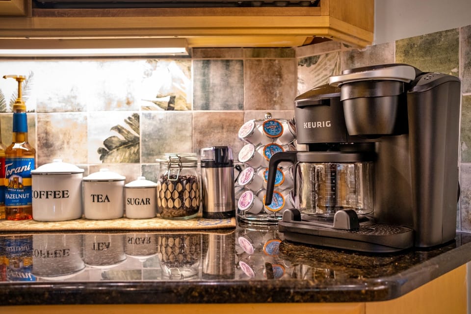 Coffee bar, Drip pot, k-cups, whole bean w/ grinder, french press, syrups, tea 