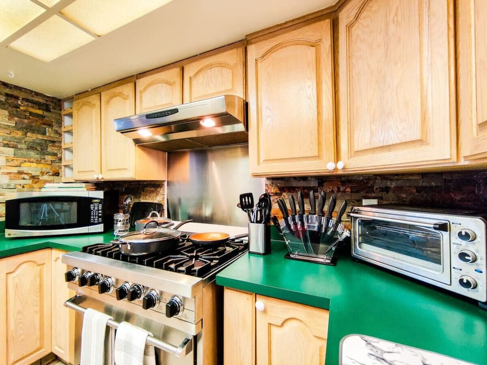 Gourmet Kitchen with 6 burner Viking Gas stove. Plenty of Utensils and cookware for your meal preparations. Microwave, toaster, crock pot etc
