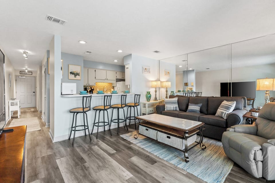 Condo, 1 Bedroom, Poolside | Living area | 60-inch LCD TV with cable channels
