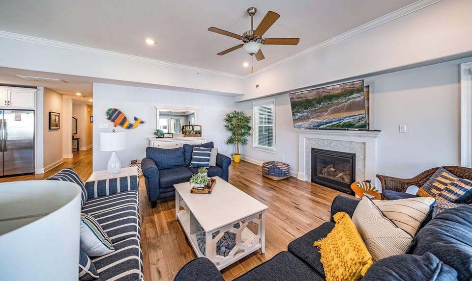 Rustic open living room area with fireplace
