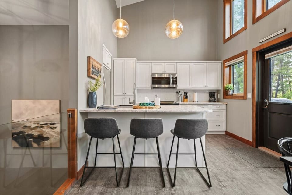 Full kitchen with walkout access to the deck & BBQ