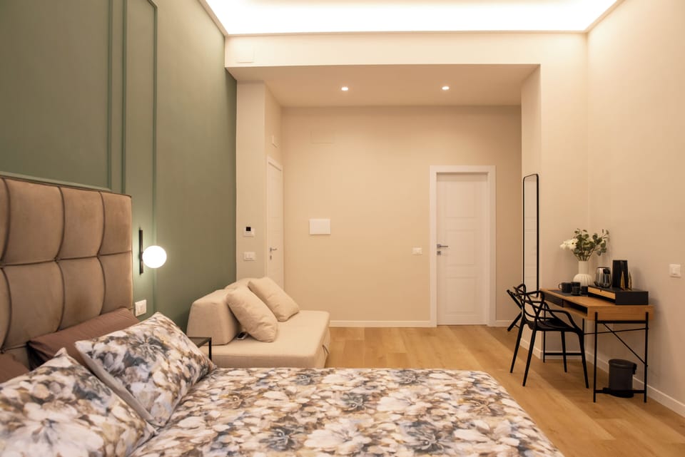 Deluxe Quadruple Room | Living area | 50-inch Smart TV with digital channels