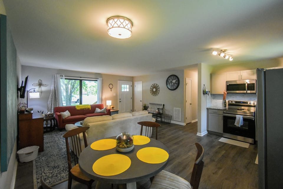 View of open concept to main living room, dining area and kitchen