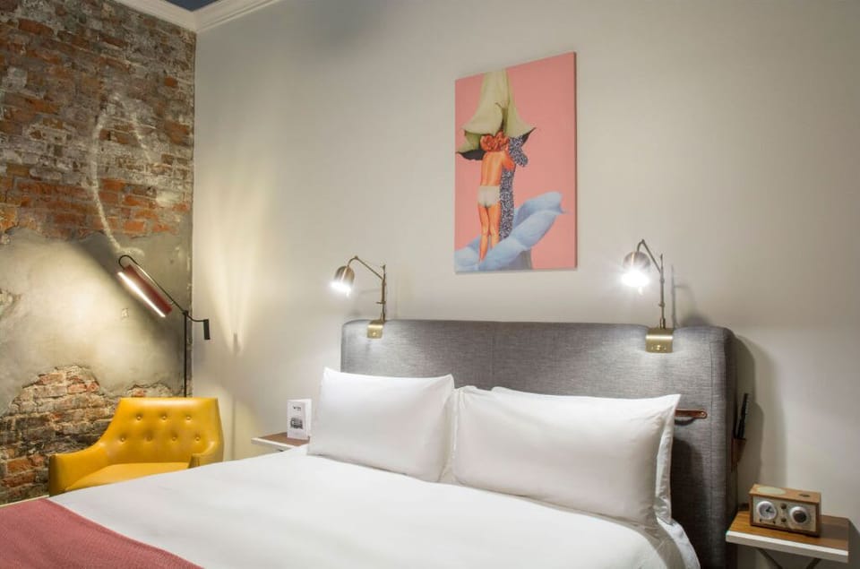 Restful sleep space framed by artistic flair and brick wall texture
