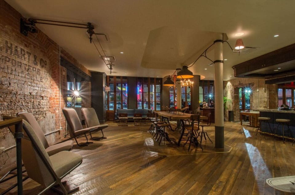 Inviting reading area with bookshelves and ample seating for guests to unwind.