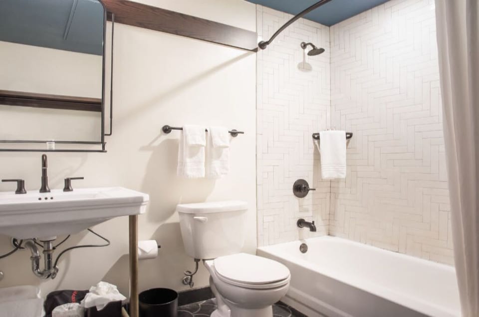Sleek and simple bathroom with crisp white tiles and modern fittings