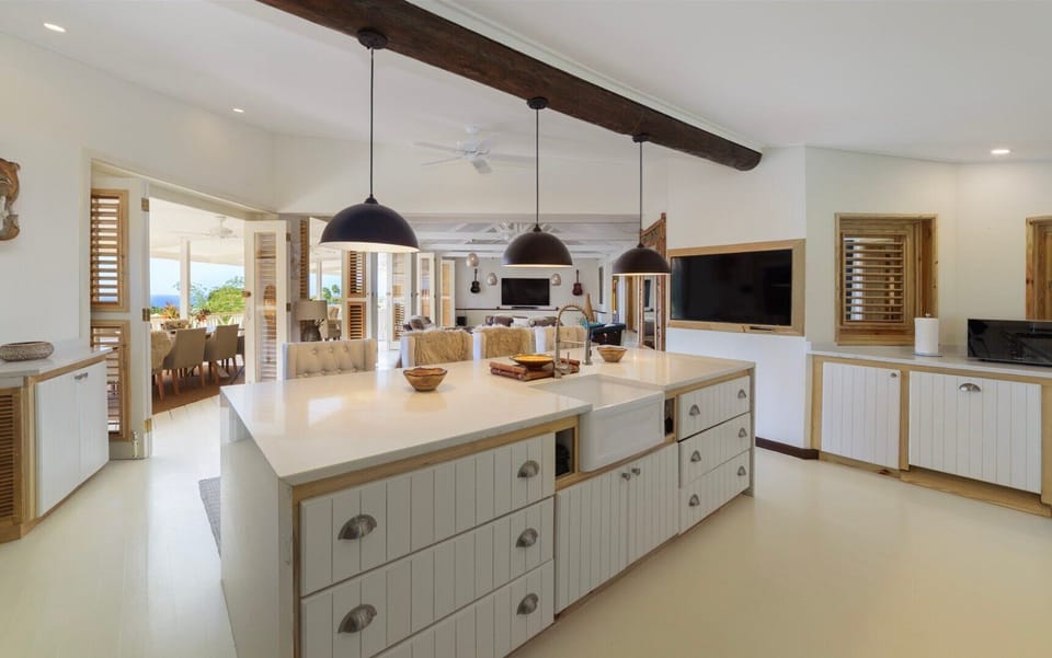 Looking from the kitchen to living and patio spaces