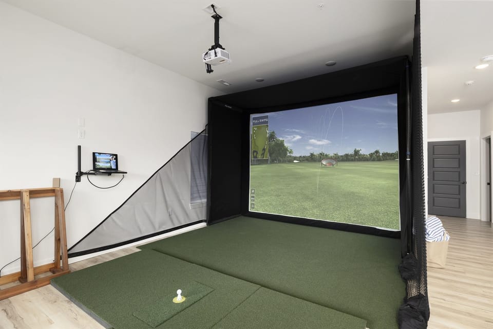 Waterfront Green - Basement level: Golf Simulator in Family & Game Room