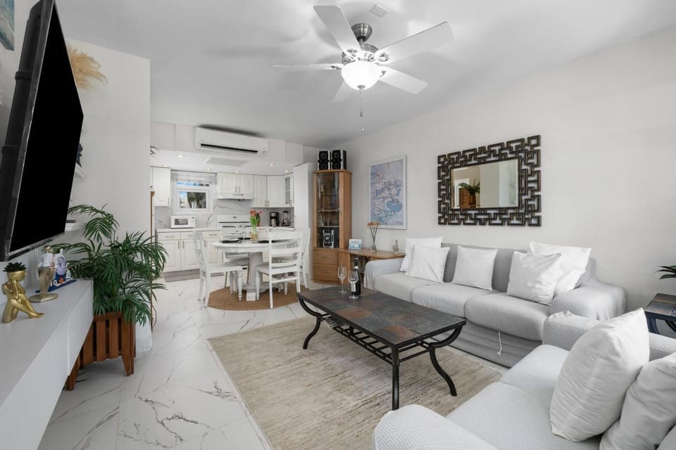The bright interiors and soft color palette create a relaxing environment, enhanced by the cool breeze of the ceiling fan. Gather with your group for a cozy night in or take a quiet moment to yourself with your favorite show on the TV.
