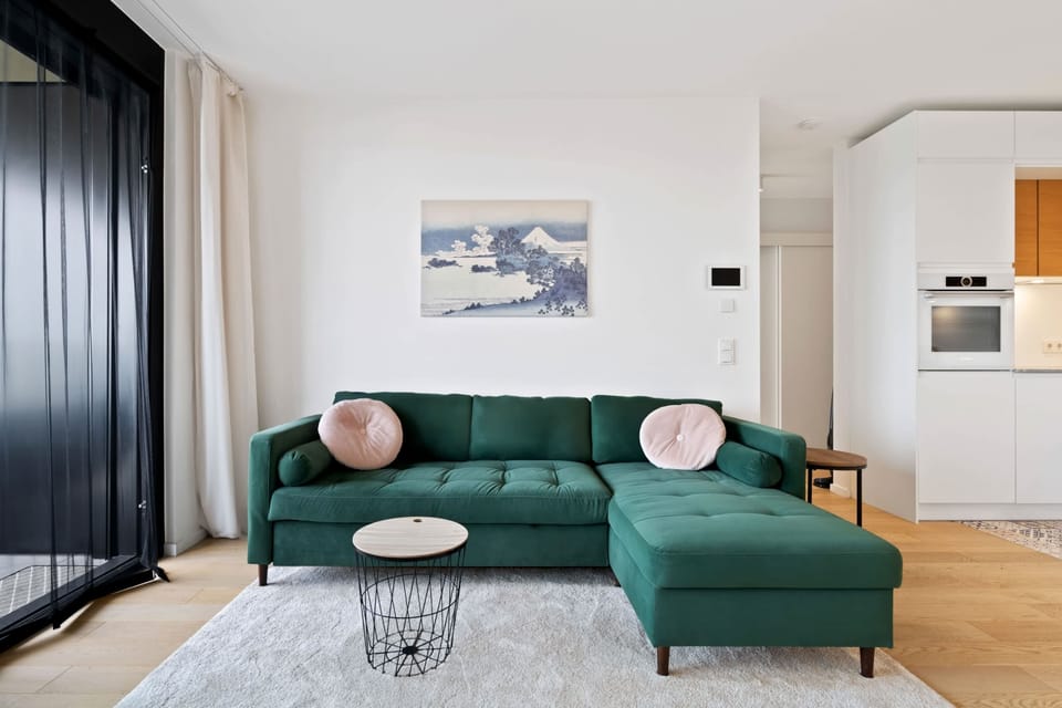 Comfortable and stylish living room with a plush sofa, perfect for relaxing after a day of exploring.