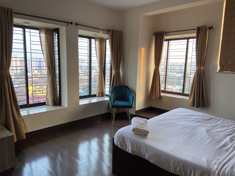 Luxury Room, Private Bathroom, City View | Desk, laptop workspace, blackout drapes, iron/ironing board