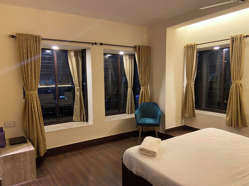 Luxury Room, Private Bathroom, City View | Desk, laptop workspace, blackout drapes, iron/ironing board