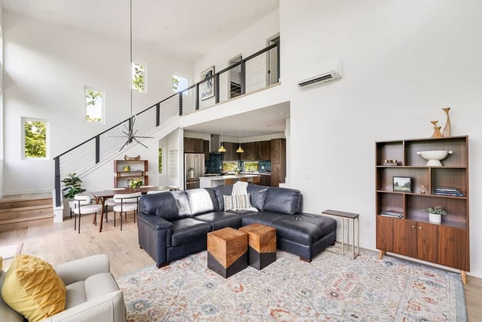Cozy up in the living room with plush leather seating, a gas fireplace, and a large smart TV. Ideal for movie nights or relaxing after a day of adventure.