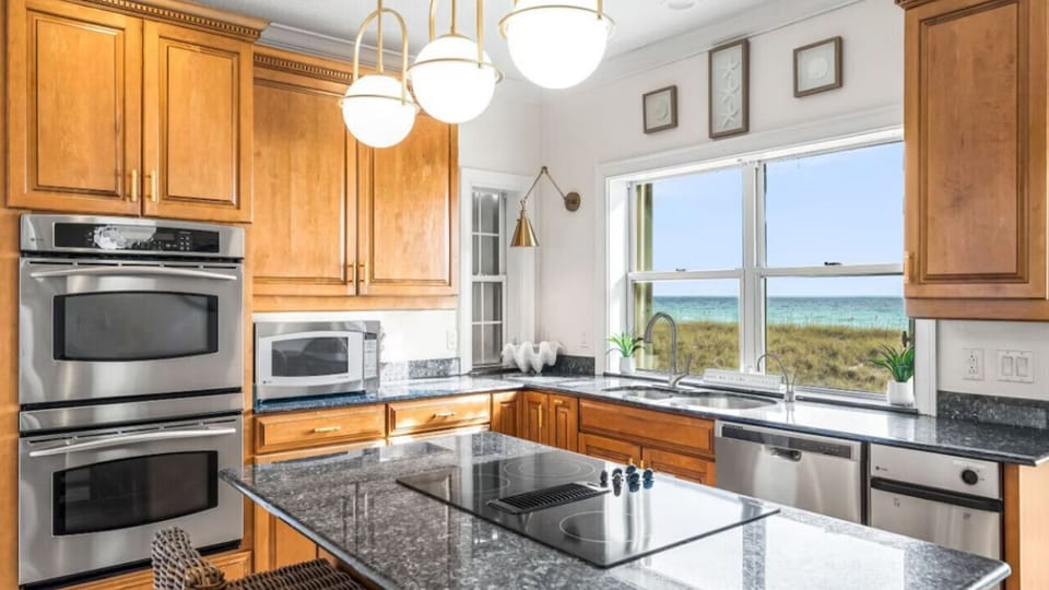 Cook while enjoying stunning sea views through your kitchen window, complete with granite counters and stainless appliances.