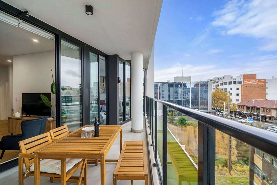 Enjoy the expansive balcony complete with comfortable chairs and a table, offering the perfect spot to unwind.