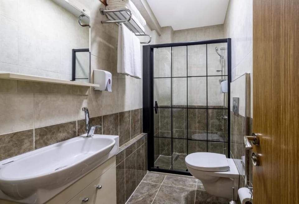 Shower, free toiletries, hair dryer, slippers