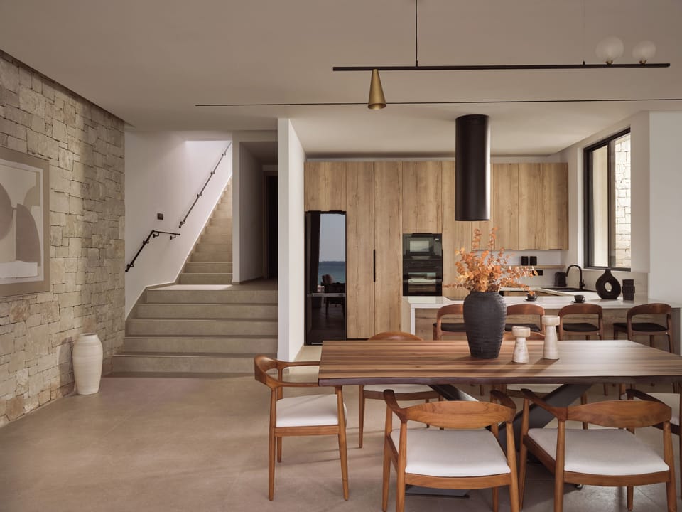 The fully equipped kitchen with indoor dining settings. 