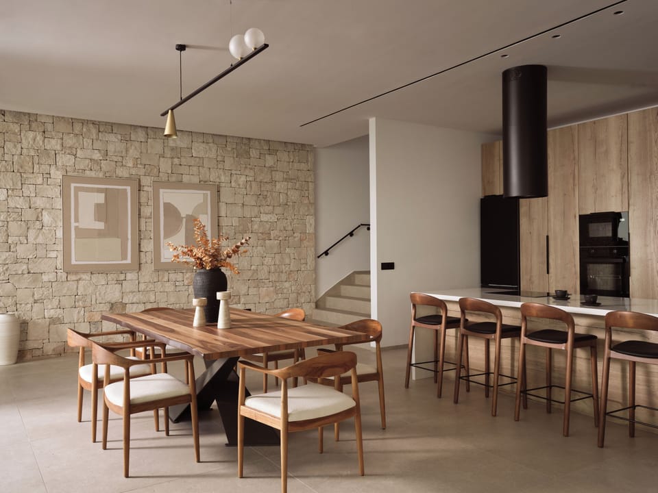 The indoor dining area and the fully equipped kitchen. 