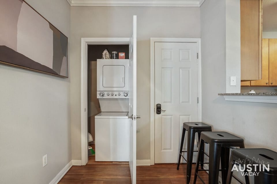 Stacked washer and dryer with some supplies available